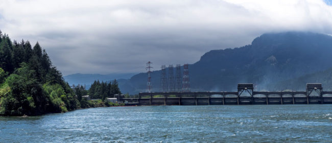 Bonneville Dam with Oregon on the left side, then the Navigation Lock and the First Powerhouse on the right side