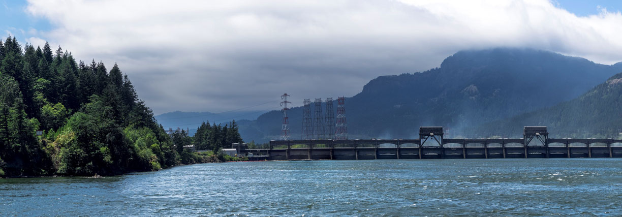 Bonneville Dam with Oregon on the left side, then the Navigation Lock and the First Powerhouse on the right side