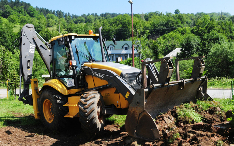 Backhoe moving dirt