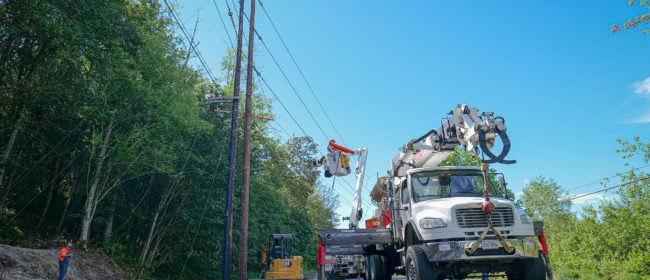 Line crew works to replace a worn transmission pole with a new one