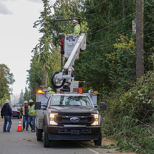 Lineman in crane bucket