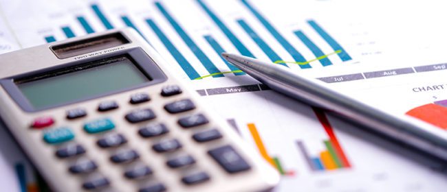 Calculator on chart and graph spreadsheet paper. Finance development, Banking Account, Statistics, Investment Analytic research data economy, Stock exchange trading, Business company concept.