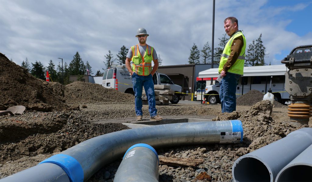 PUD Electrical Engineering Manager, Jimmy Scarborough verifies vault and conduit installation at the Jefferson County Transit Centers fleet yard. 