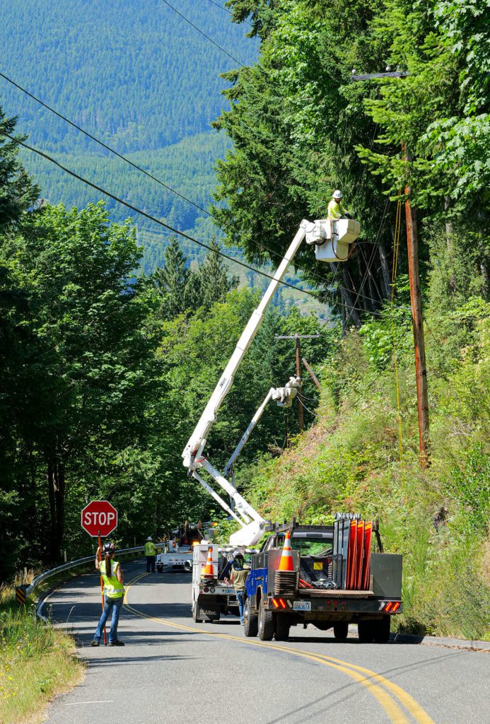 PUD line crew rigging poles on the Bolton Peninsula outside Quilcene.
