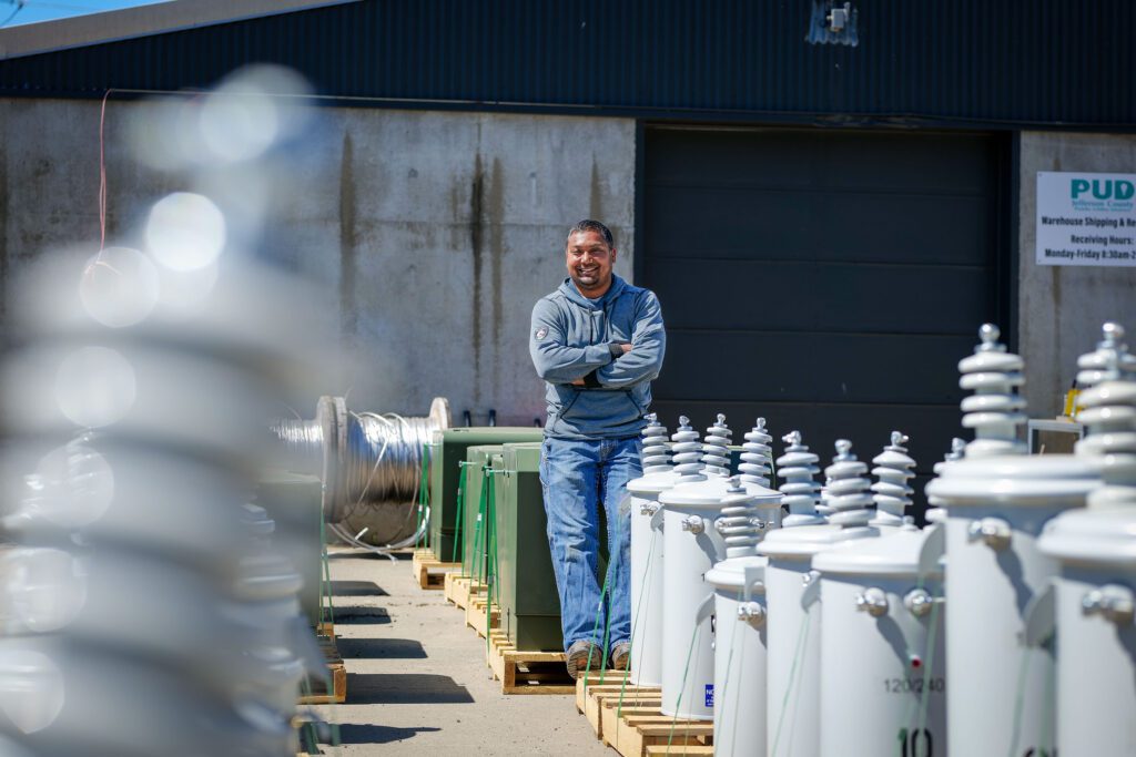 Born & raise here in Jefferson County, PUD Storekeeper, Jesse Bland, stands with a shipment of refurbished transformers at The PUD headquarters.