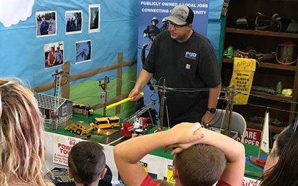 PUD employee at fair stand
