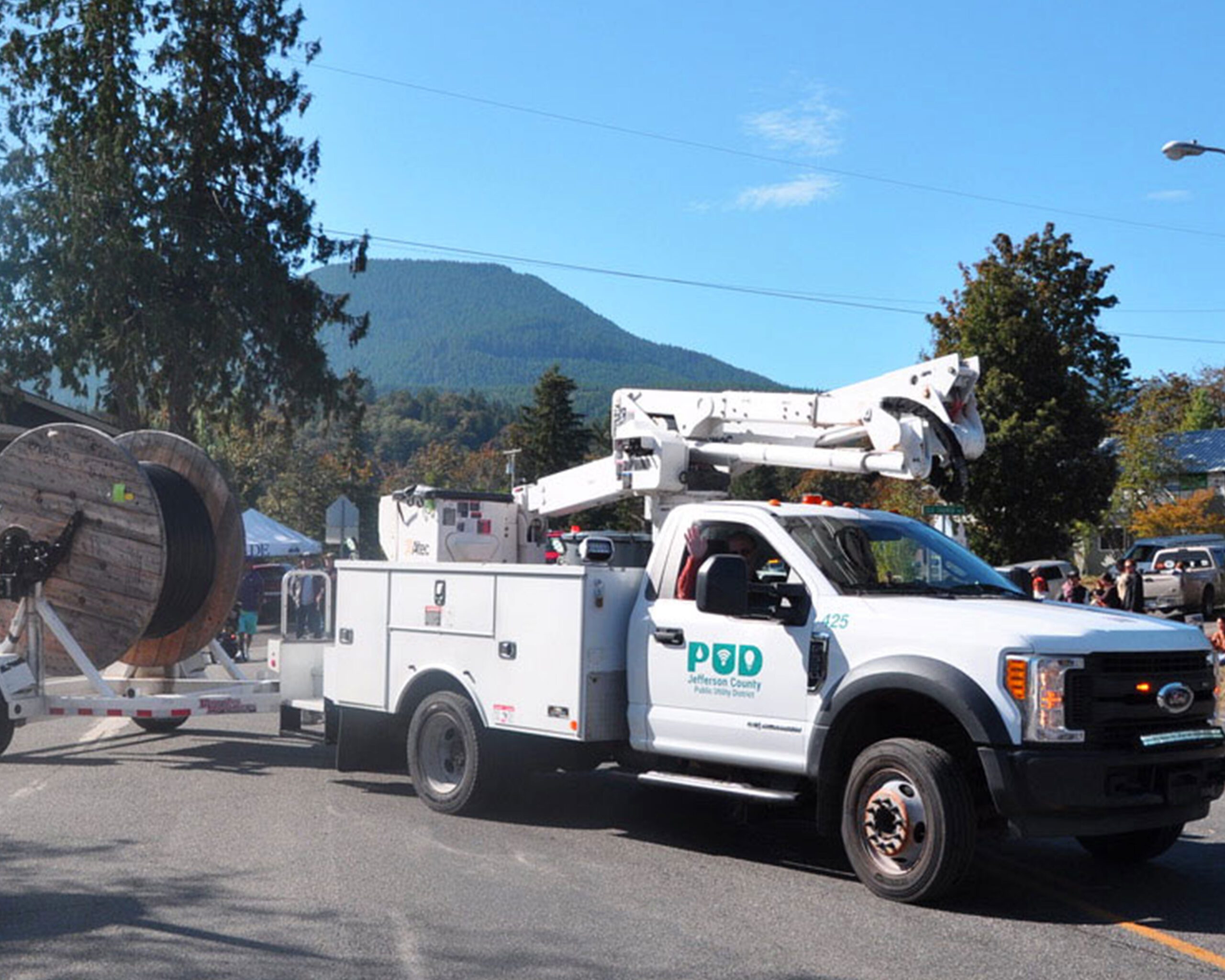 Fiber installation truck with spool of fiber