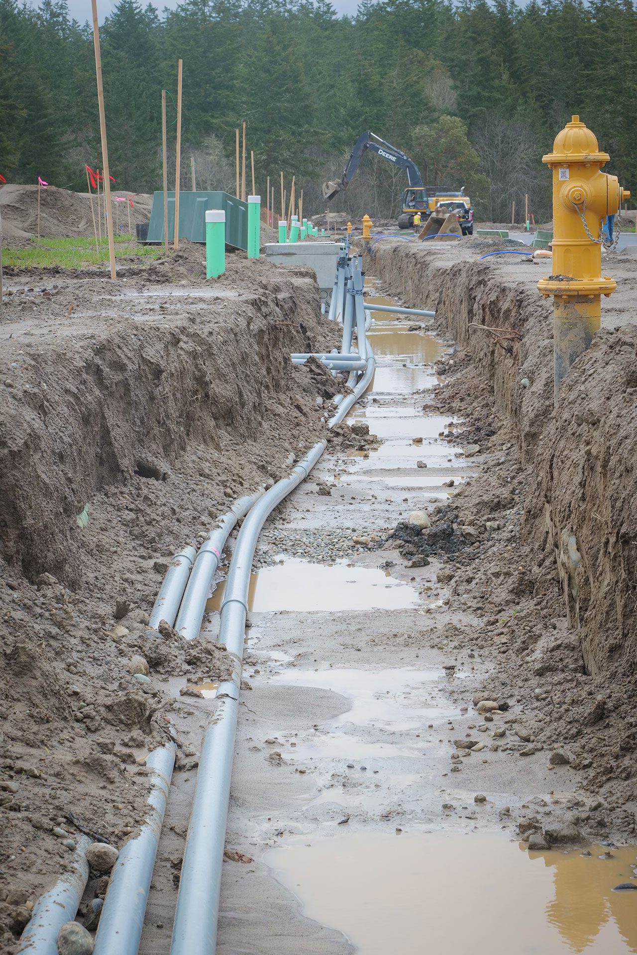 Madrona Ridge subdivision project trench muddy, after heavy rainfall
